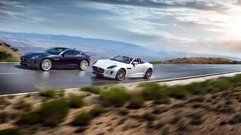 Two Jaguar Cars — White