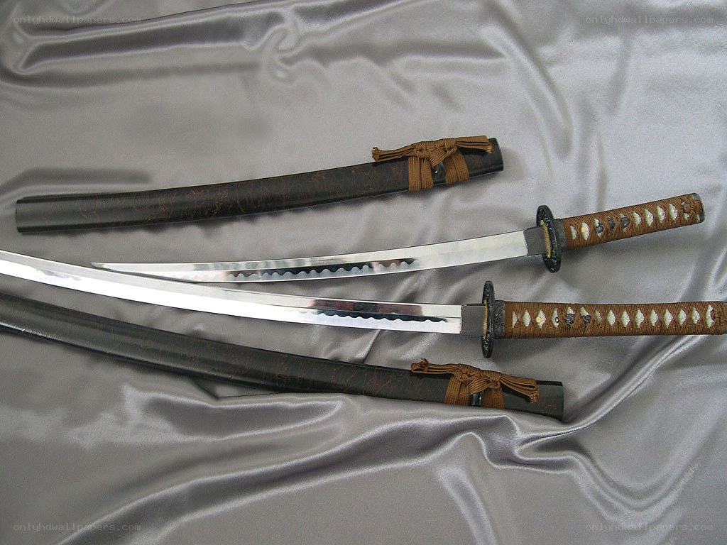 Two Japanese swords on fabric