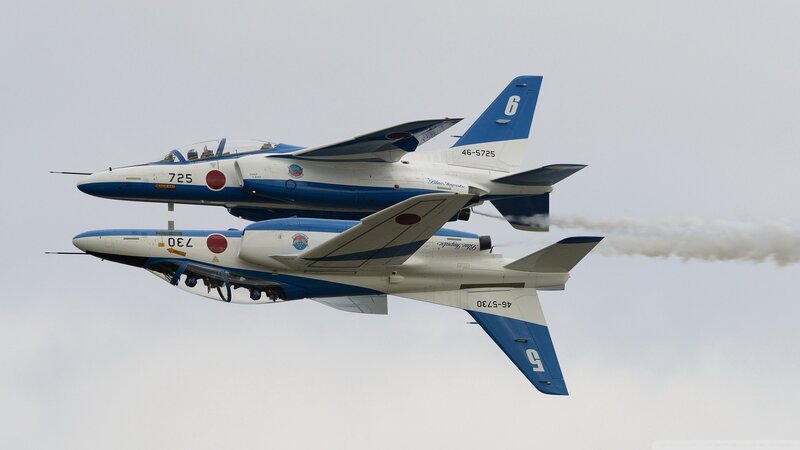Two Jet Aircraft in Formation — Blue