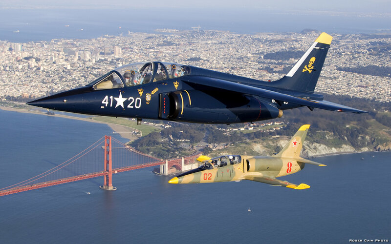 Two Jets Flying over Bridge