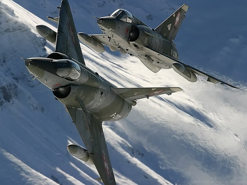 Two jets flying over snow