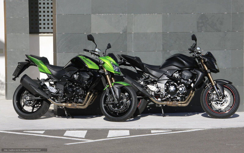 Two Kawasaki motorcycles parked