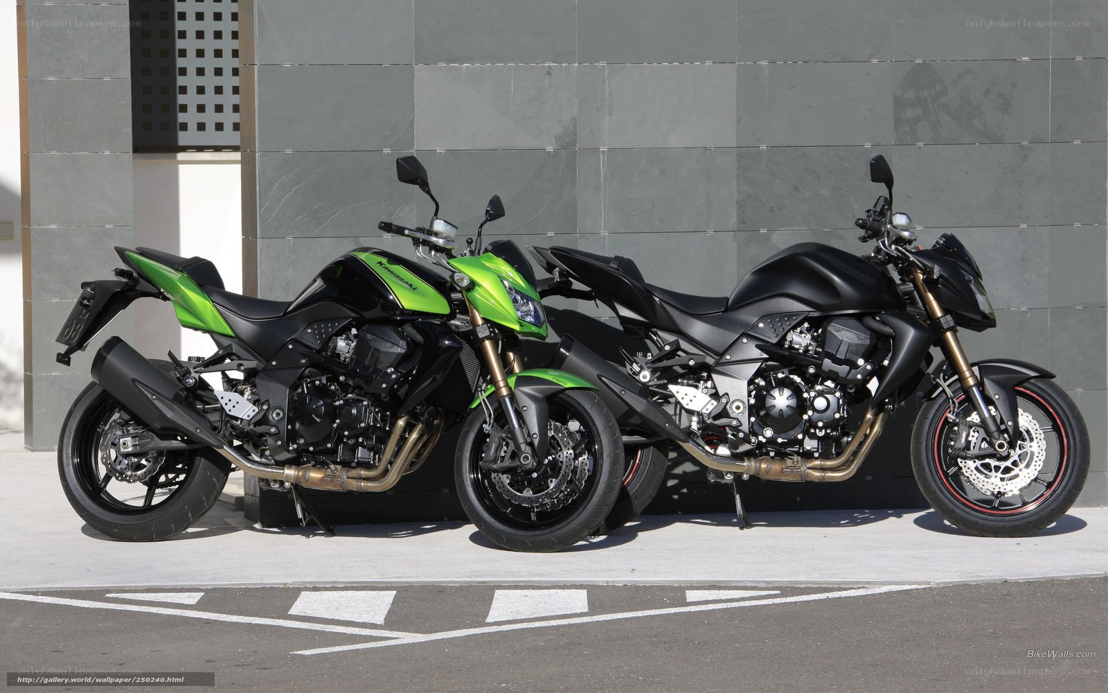 Two Kawasaki motorcycles parked
