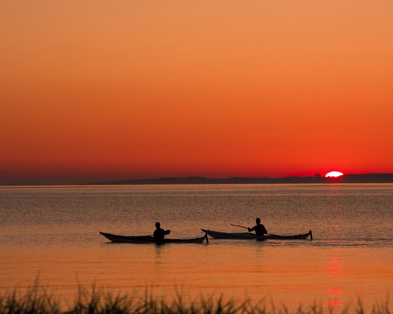 Two Kayakers at Sunset — Photograph