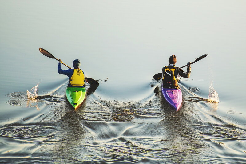 Two Kayakers on Water — Blue