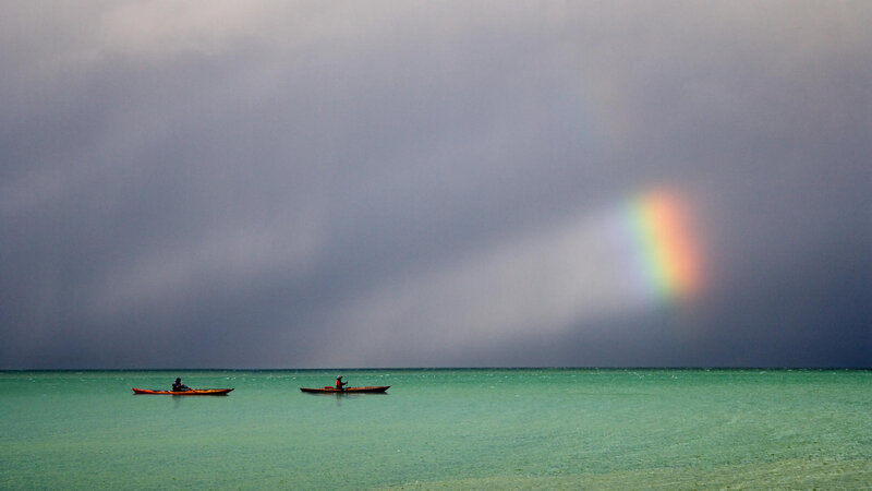 Two Kayakers on Water — Green