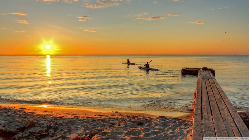 Two Kayakers on Water — Orange, Serene, Sunset