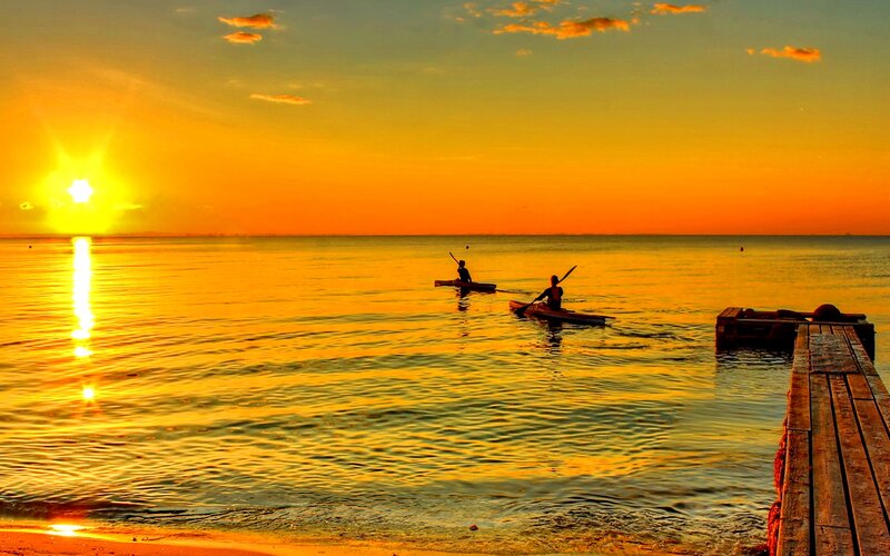 Two Kayakers on Water — Orange, Serene