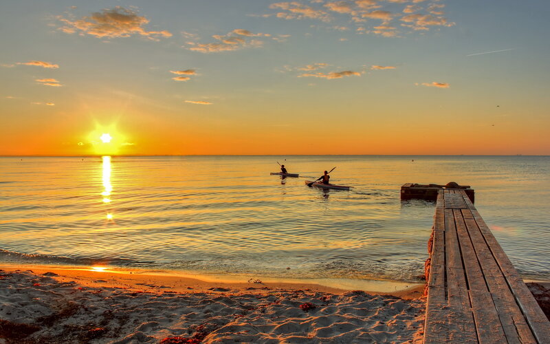 Two Kayakers on Water — Orange