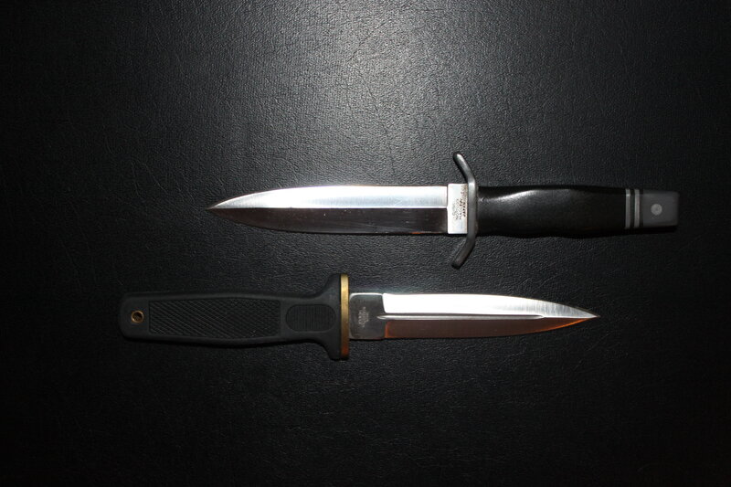 Two Knives on Black Surface