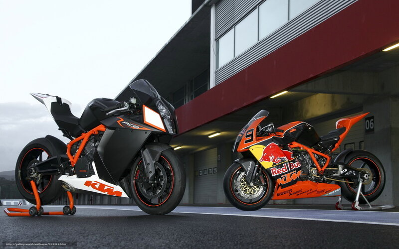 Two KTM Motorcycles — Orange