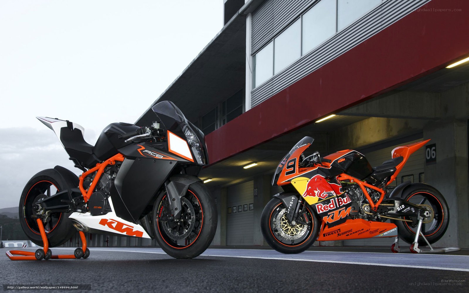 Two KTM racing motorcycles