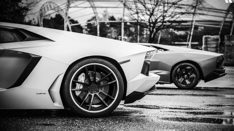 Two Lamborghini Aventadors parked