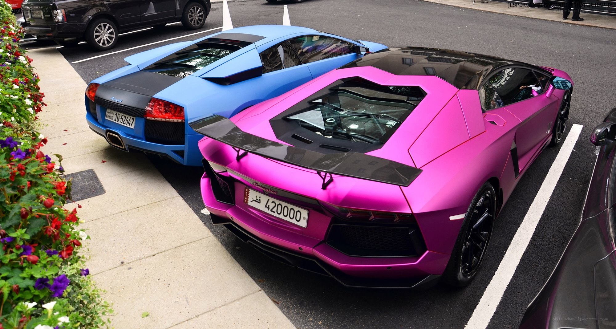 Two Lamborghini Aventadors parked