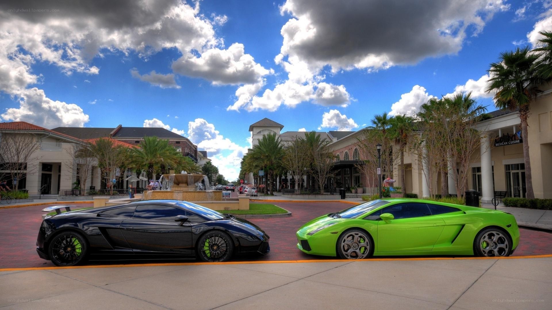 Two Lamborghinis in a plaza