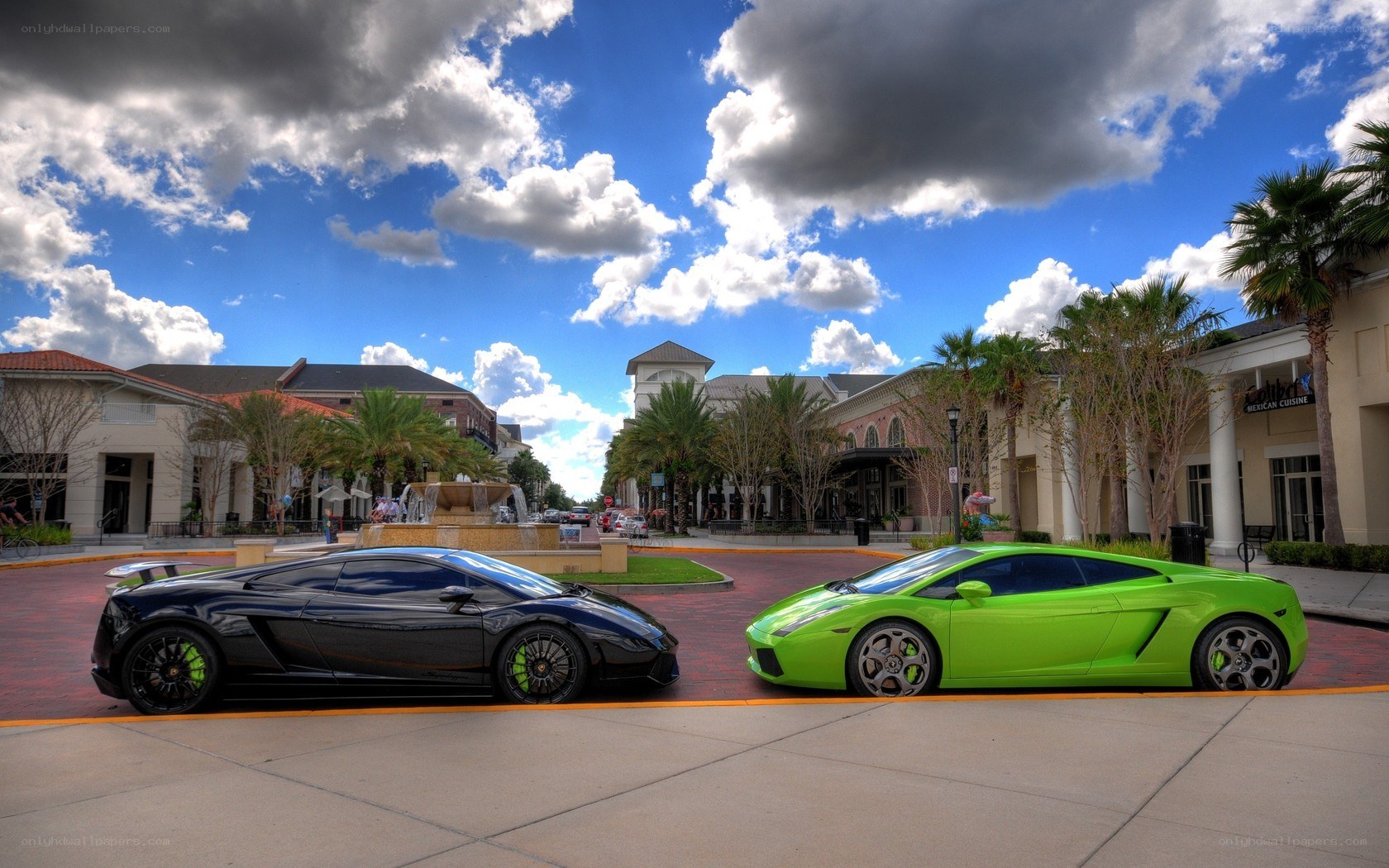 Two Lamborghinis in a plaza