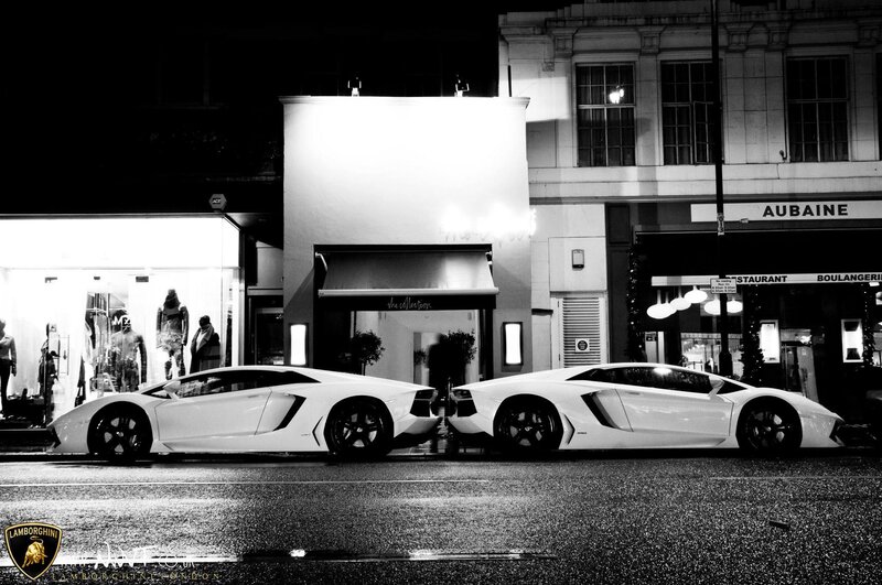 Two Lamborghinis on a city street