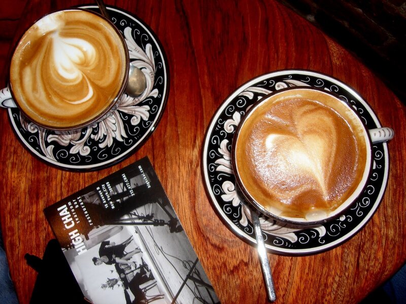 Two lattes on a wooden table