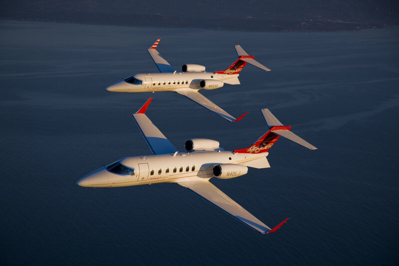Two Learjet aircraft in flight