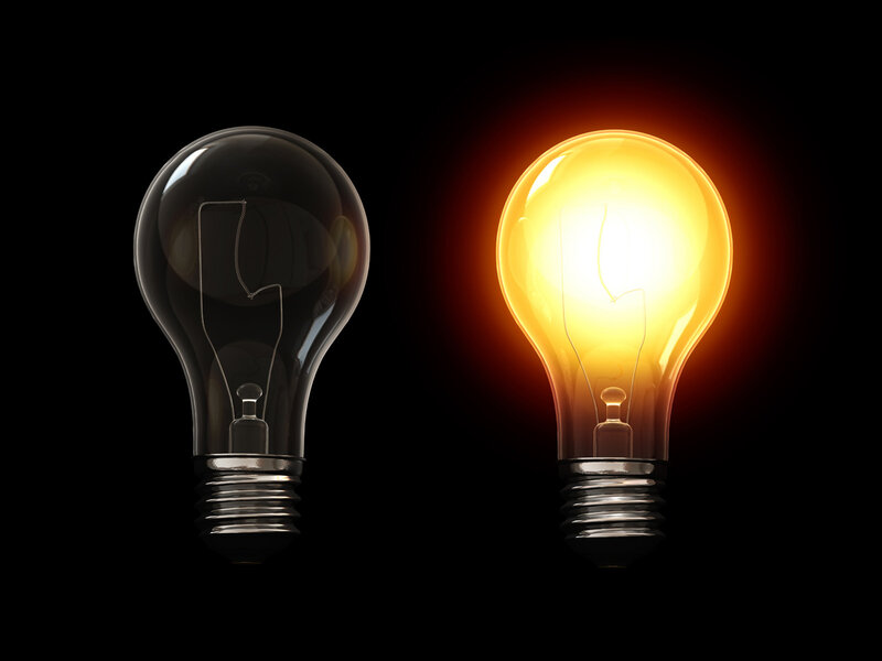 Two light bulbs on black background