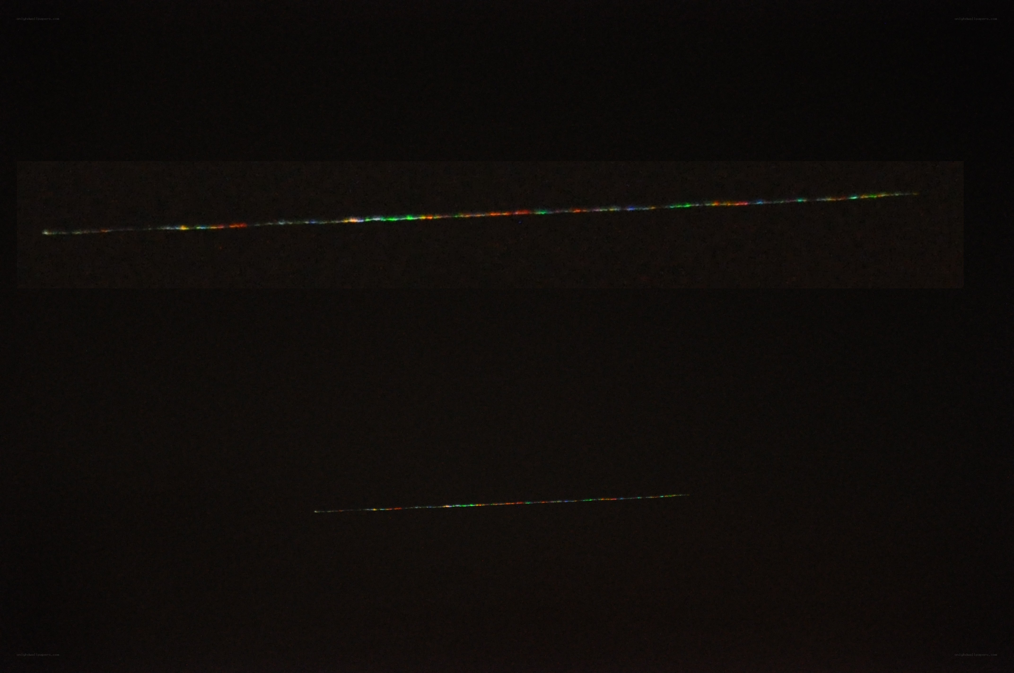 two light trails in dark sky