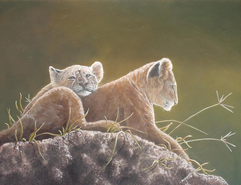 Two lion cubs on a rock