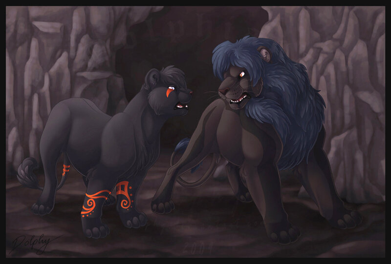 Two lions in a cave