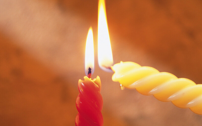 Two lit candles close-up