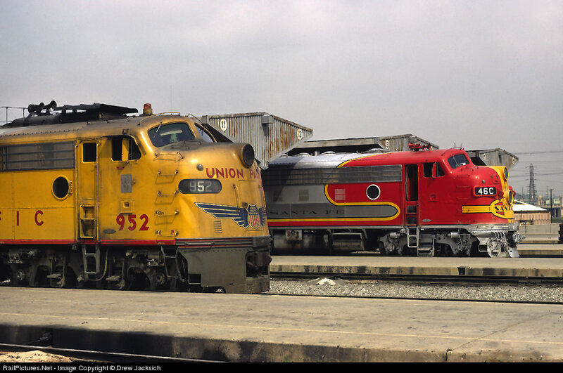 Two Locomotives on Tracks — Yellow