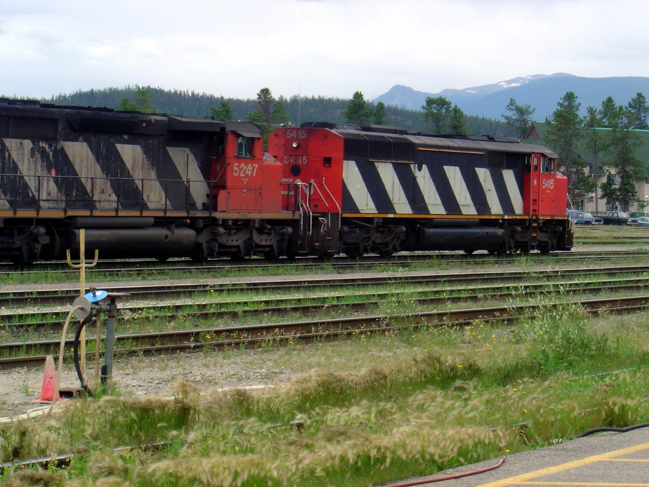 Two locomotives on tracks