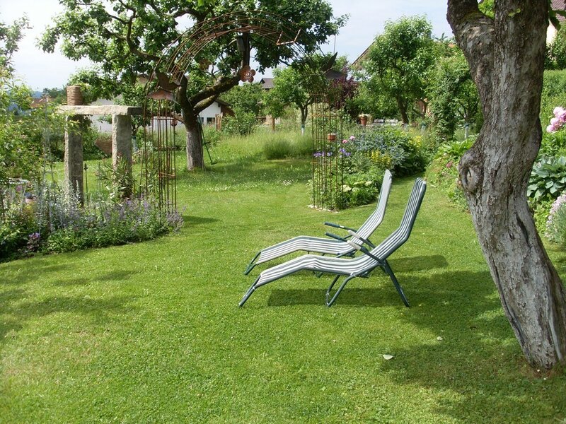 Two Lounge Chairs in Garden