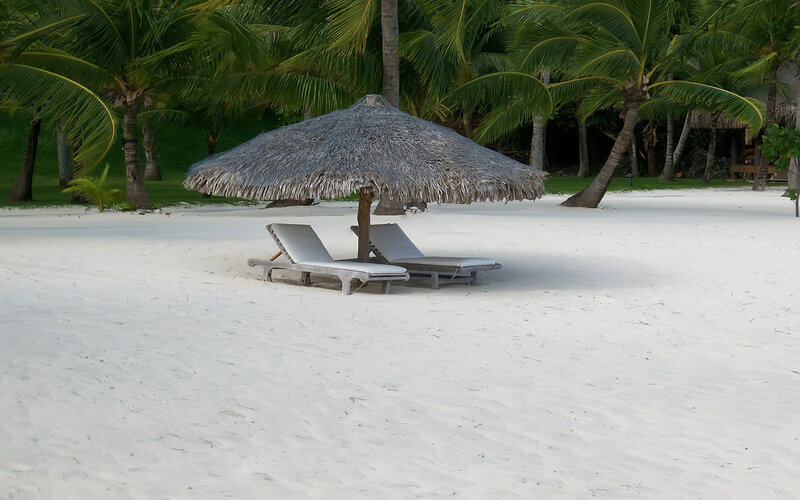 Two Lounge Chairs under Umbrella
