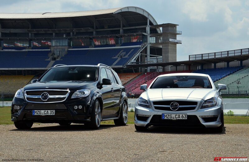 Two luxury cars at a racetrack