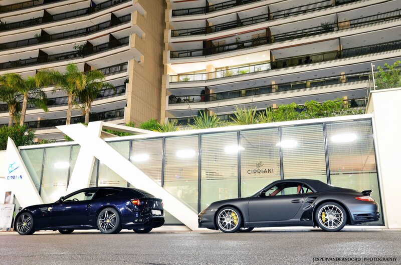 Two luxury cars at night