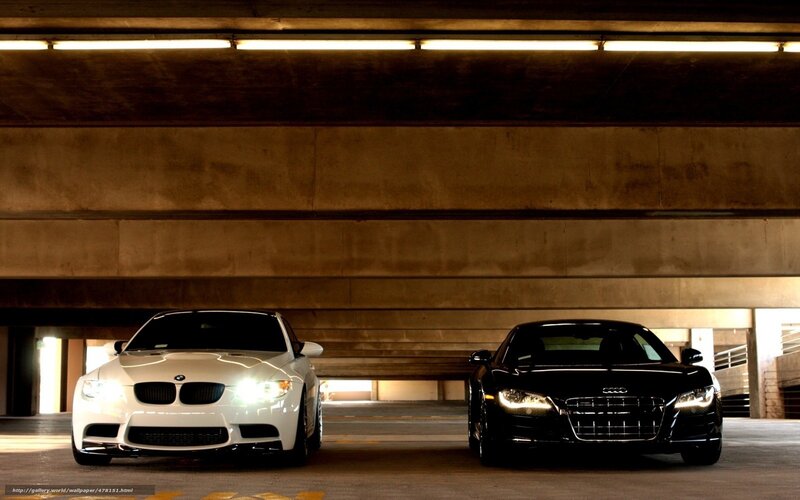 Two luxury cars in a garage