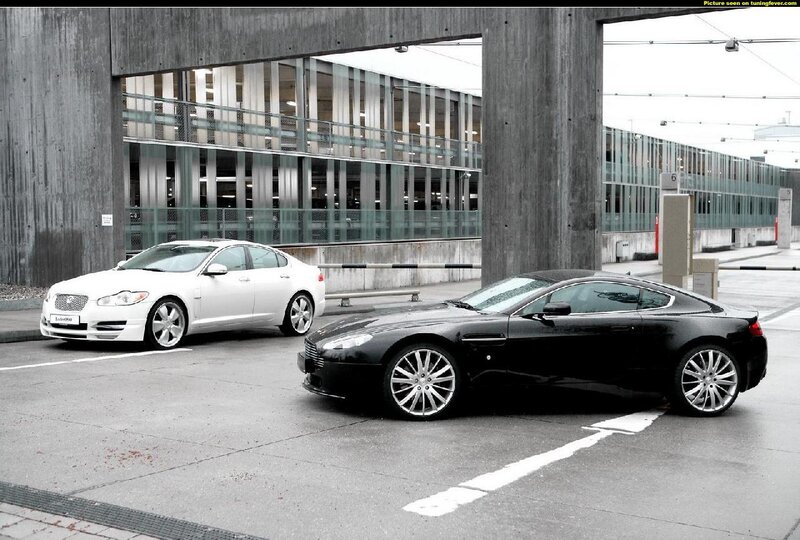 Two luxury cars in a parking garage