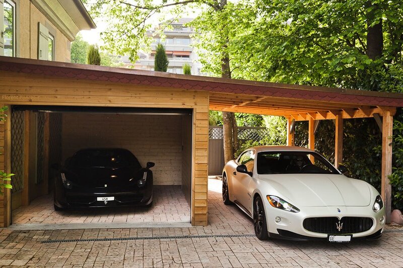 Two Luxury Cars in Garage
