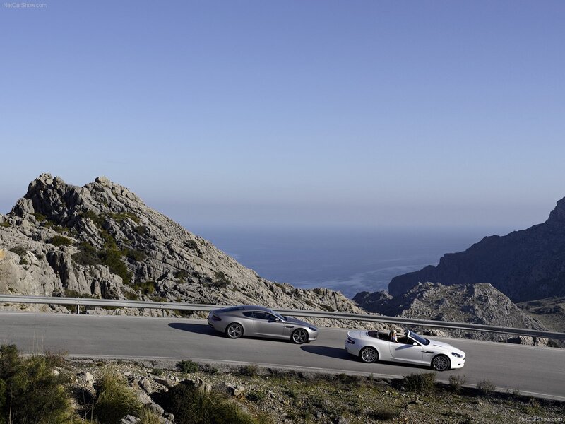 Two Luxury Cars on a Road