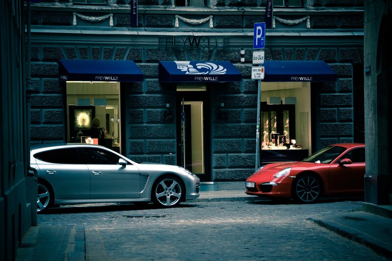Two Luxury Cars on Street