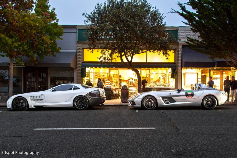Two luxury cars parked on street