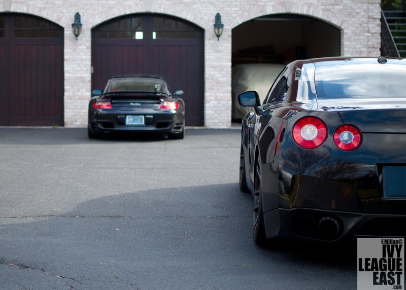 Two luxury sports cars in a driveway