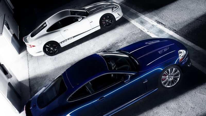 Two luxury sports cars in a garage