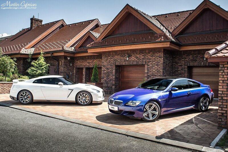 Two luxury sports cars in driveway