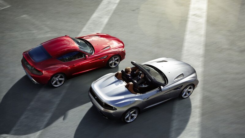 Two luxury sports cars in motion