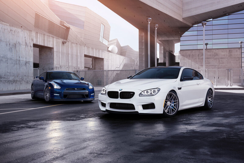 Two luxury sports cars in urban setting