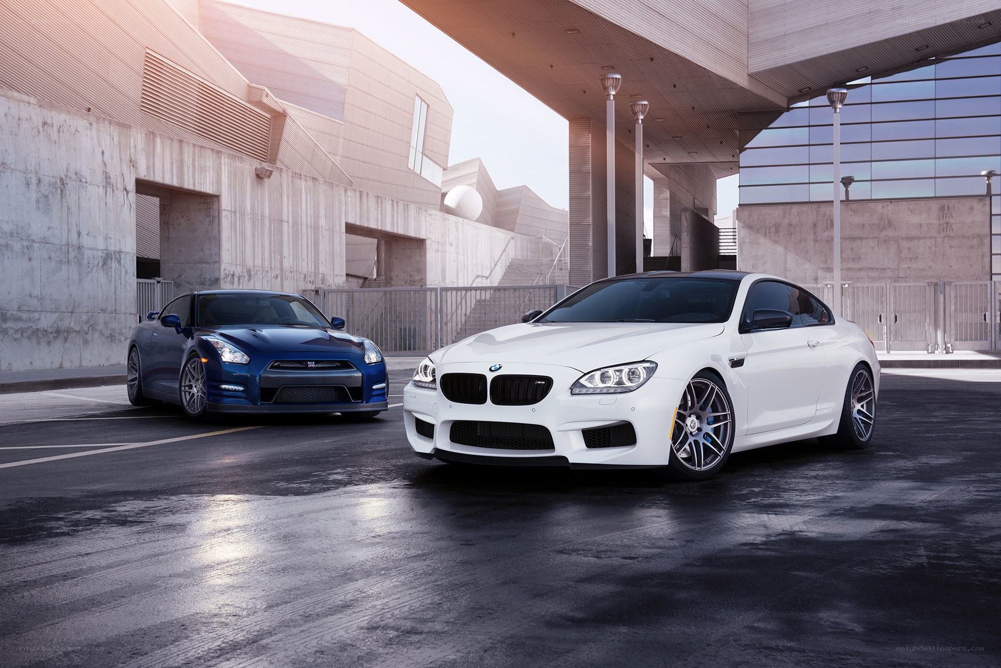 Two luxury sports cars in urban setting