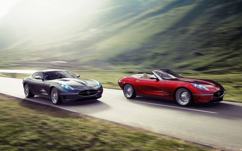 Two luxury sports cars on a road