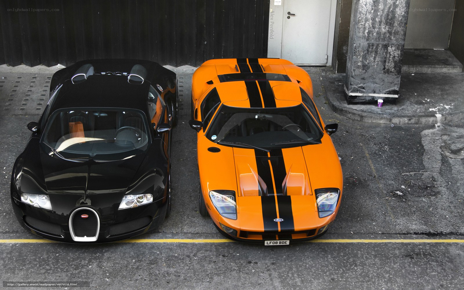 Two luxury sports cars parked