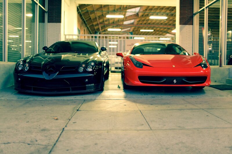 Two luxury sports cars parked