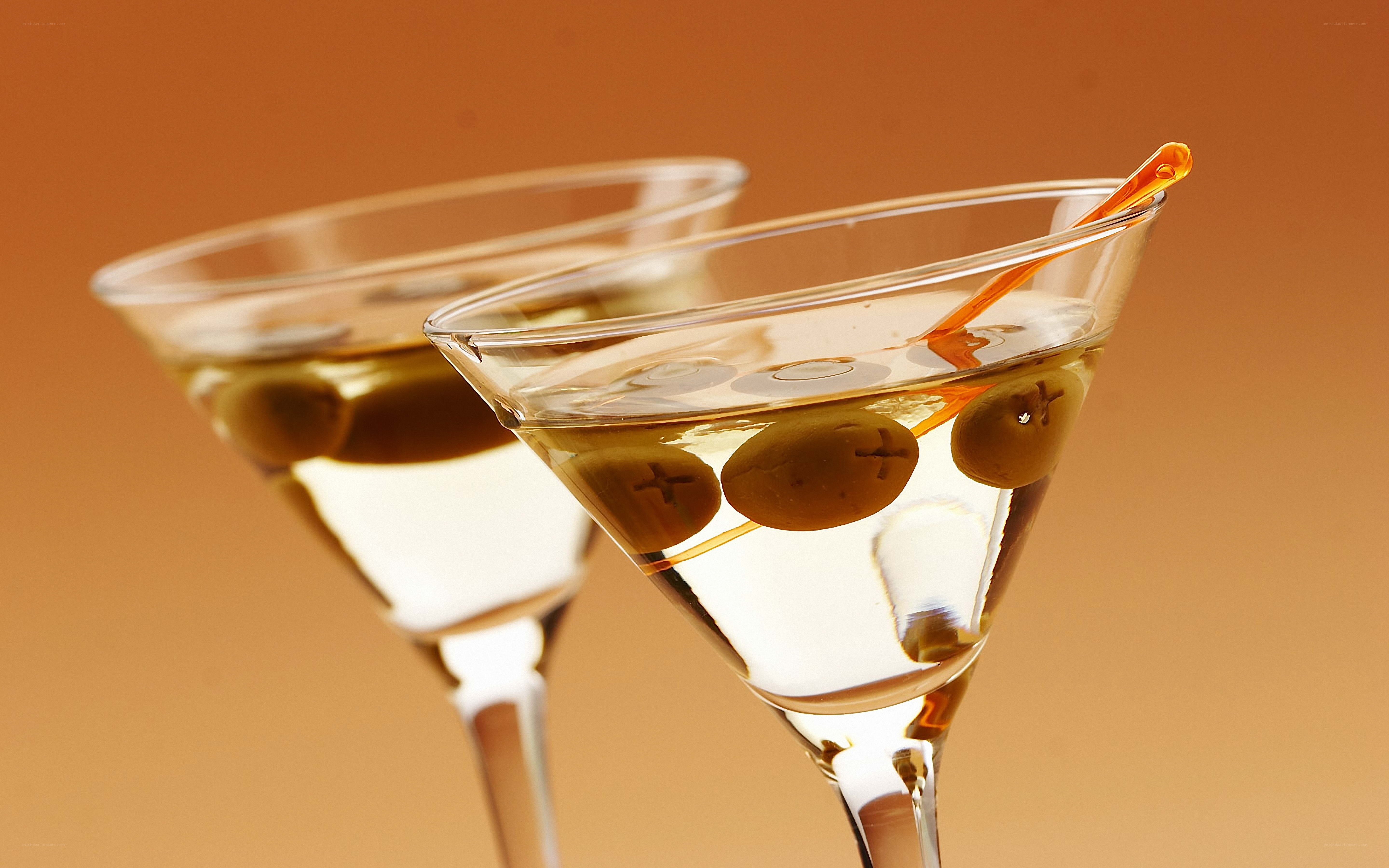 Two martini glasses with olives